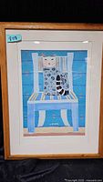 Full framed print showing the colorful cat on blue chair image, signed by artist.
