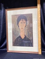 Full view of framed portrait print with ruler showing size approximately 31.5 inches tall and 23.5 inches wide