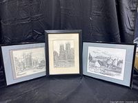 Photo showing all three framed sketches arranged side by side against a black background.
