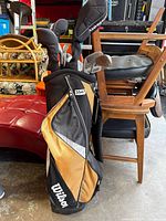 Photo of Wilson golf bag standing with 11 golf clubs inside