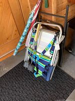 Group shot showing folded chairs, umbrellas, and pie irons