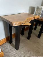 Front angled view of live edge side table showing top and legs