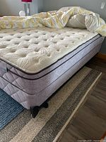 Queen mattress and box spring on bed frame