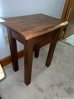 Angled view of entire wood side table front and left sides