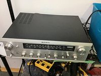 Front view of Sony STR-6050 receiver showing controls and dial