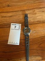 Front view showing dial, bezel, and strap