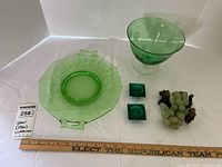 Green glass dishware lot showing all 5 items on a white surface with a ruler for scale