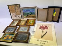 Lot displayed showing multiple framed artworks including botanical print, figure sketches, landscape, still life, and birds.