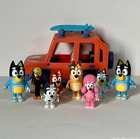 Front view of SUV vehicle and eight Bluey character figures