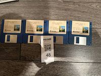 Four blue 3.5" Sierra King's Quest IV floppy disks, Disk 1-4 visible