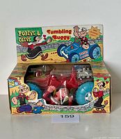 Front of boxed Popeye & Olive tumbling buggy toy showing vehicle and figure