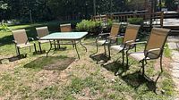 full set outdoors showing table and six chairs