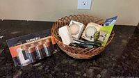 Basket with timers, adapters, flashlight and battery pack
