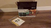 Original Polk Audio Atrium 4 box with manual/hardware pouch in foreground