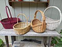 All four baskets on outdoor shelf showing colors, sizes and handles