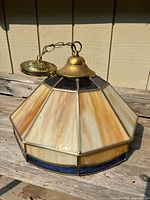 Full view of stained glass pendant shade showing colors and overall design