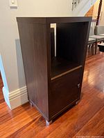 Full side view of cabinet showing veneer finish and open compartment