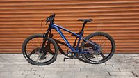 Full right-side view of blue Kona Fire Mountain mountain bike
