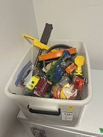 Overview of bin with mixed cars and parts