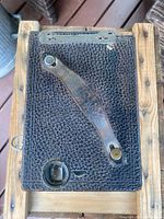 Top view showing leather strap and textured covering