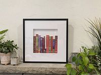 Front view of framed artwork showing overall design and frame