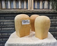 Front view of three hardwood hat blocks