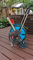 Full view of Gardena hose reel cart with hose