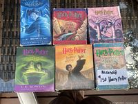 All six boxed audiobook sets arranged in two rows