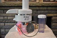 Front view of assembled Jack LaLanne Power Juicer with accessories on table