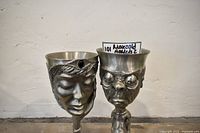 Front view of both pewter goblets, Galadriel left, Gollum right