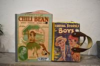 Front view of both purses showing original cover graphics and belt handles