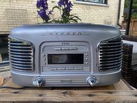 Front view showing TEAC vintage-style stereo radio CD player, speaker grilles, controls and display
