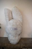 Front view of faux-fur rabbit mask showing overall shape and ears