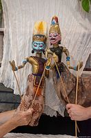 Both puppets front view with rods held