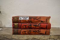 Stack of three Chums annuals showing illustrated spines and wear