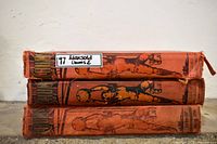 Three CHUMS hardcover annuals stacked spine out