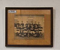 Front view of framed sepia rugby team photograph