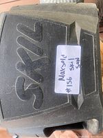 Top view showing black housing with raised Skil logo