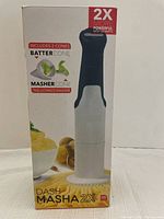 Box for Dash Masha 2X electric food masher, highlighting it is 2 times more powerful with 160 watts, and includes 2 cones: batter cone and masher cone. BPA free.