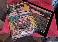 Photo showing the plastic tablecloth in packaged condition with colorful abstract design and French text on label.