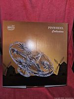 Box packaging showing Bohemia Crystal Pinwheel Collection cake plate on stand image and branding.
