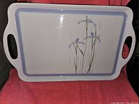 Photo of the rectangular white melamine tray with purple iris floral design and purple border.
