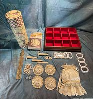 All items laid out showing tray, wine box, rosettes, plaque, curtain hardware, sachet, screws