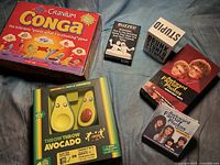 All six game boxes arranged on surface