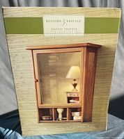 Front of boxed Restore & Restyle Exotic Travels mirrored cabinet