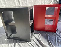 Black and red open-shelf tables front view