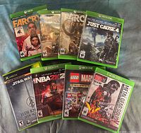 Front view of all eight Xbox One game cases