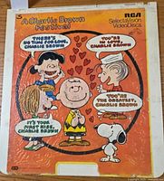 Orange cover of A Charlie Brown Festival Volume I RCA SelectaVision VideoDisc, showing Peanuts characters with speech bubbles