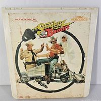 Front cover of RCA Videodisc for Smokey and the Bandit with characters, microphone cord design, and title logo