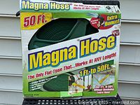 Photo shows the product box of Magna Hose, highlighting the 50 ft length, 8-pattern nozzle, and features like lightweight, durable, expandable from 1 ft to 50 ft, for garden use.
